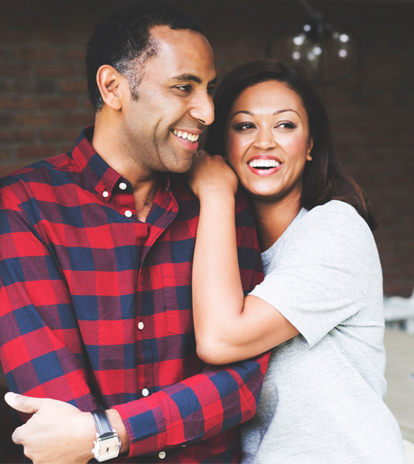 couple hugging while smiling